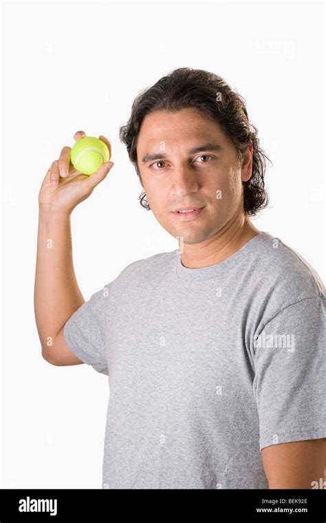 Man Holding A Tennis Ball Stock Photo Alamy