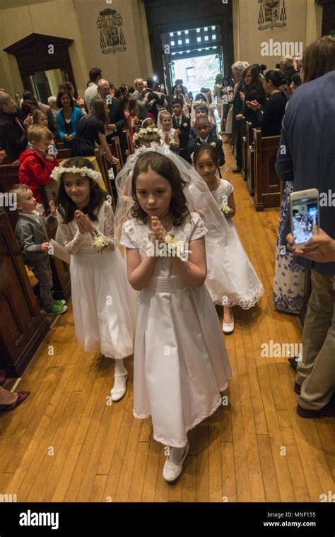 First Holy Communion Ceremony For Children At A Catholic Church In