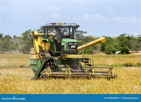 A Grain Harvester At Work In A Rice Field At Panama In Sri Lanka