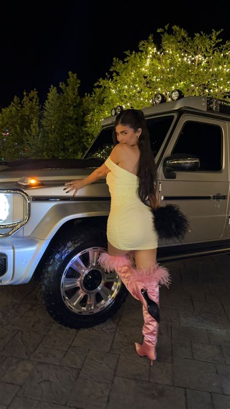 Kylie Jenner Shows Off Her Butt In Skintight White Mini Dress As She Poses On Her 130k G Wagon
