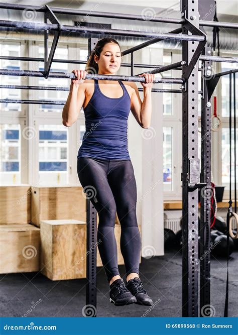 Young Woman Doing Pull Ups In The Gym Stock Photo Image Of Female