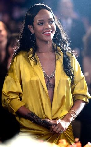 Rihanna Wows In Revealing Yellow Silk Robe Tempts Wardrobe Malfunction