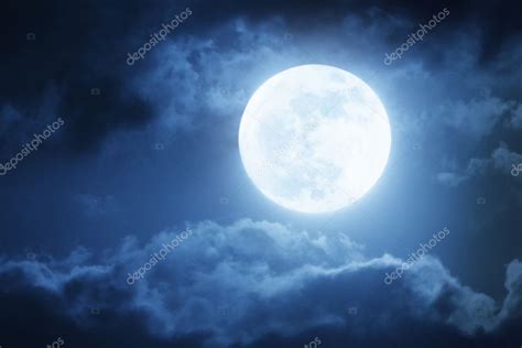 Dramatic Nighttime Clouds And Sky With Large Full Moon Stock Photo By