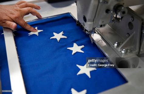 A Worker Sews Stars On A New Betsy Ross Flag Made Out Of Fire Proof