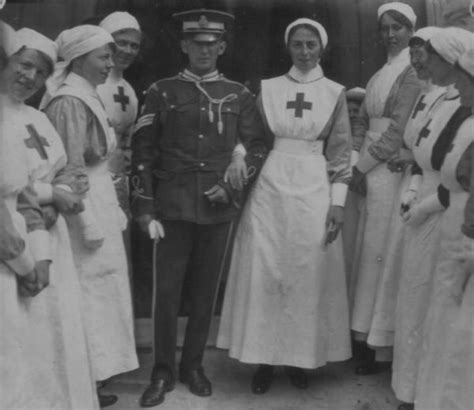 A Red Cross Nurse And Her Soldier Groom Prepare To Walk Past A Line Of Red Cross Vad Nurses At