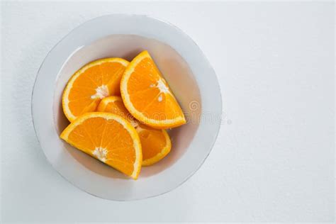 Slices Of Oranges In Bowl On White Background Stock Image Image Of