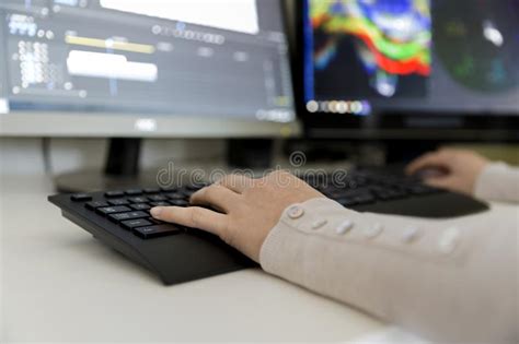 Female Video Editor Works With Footage On Her Personal Computer She