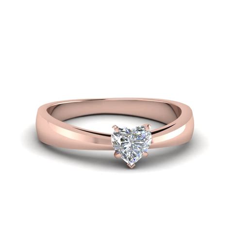 Although it's definitely the least common type of gold, rose gold's popularity has increase hugely in the past 10 years as people realise that it offers an unusual and stunning combination. Tapered Heart Shaped Solitaire Engagement Ring In 14K Rose Gold | Fascinating Diamonds