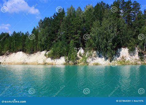Trees Grow On The Shores Of A Turquoise Lake Stock Image Image Of
