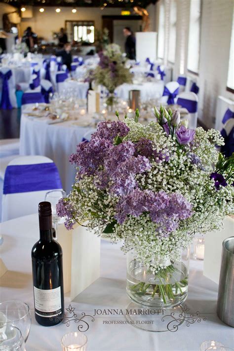 White Gypsophila And Purple Lilac Wedding Table Arrangement