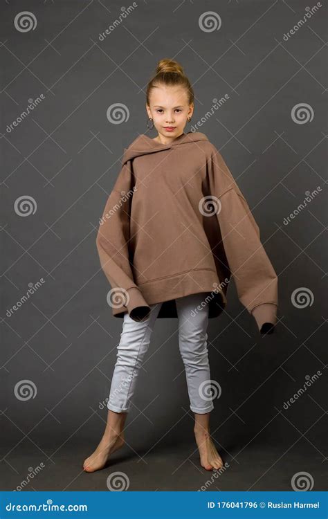 Child Girl With Long Hair Gathered In A Bun Stock Photo Image Of