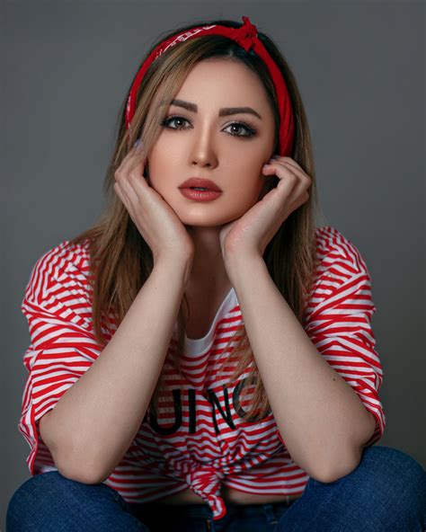 woman in red and white striped long sleeve shirt photo free iranian image on unsplash