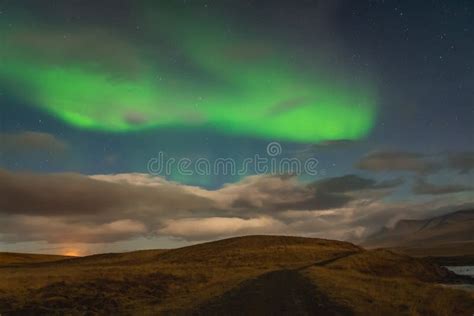 Aurora Borealis In Iceland Northern Lights Bright Beams Rising In Green