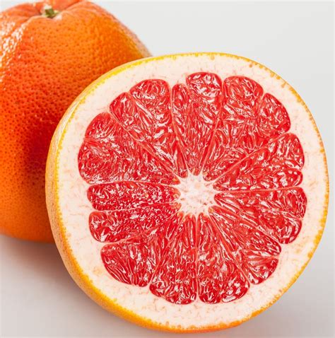 Whole And Cut Grapefruits Stock Photo Image Of Orange 62413666