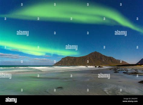 Aurora Borealis Northern Lights Over The Frozen Skagsanden Beach