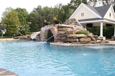 This pool waterfall is easy to install, simple to set up, and a great option for a large pool. The Hottest Poolside Landscape Trends To Shape Your ...