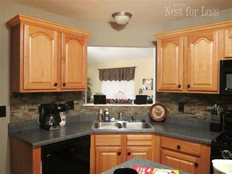 Since you have the paint out make sure you do any touch. Mini Makeover: Crown Molding on My Kitchen Cabinets ...