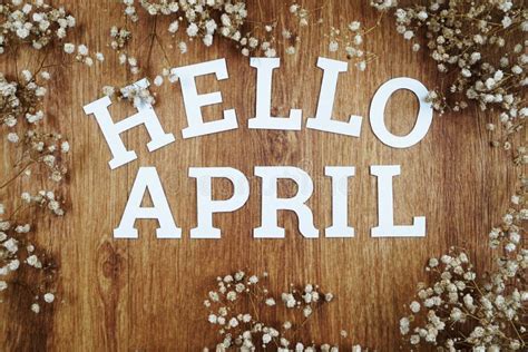 Hello April Alphabet Letters With Dried Flower On Wooden Background