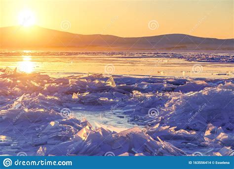 Colorful Sunset Over The Crystal Ice Of Baikal Lake Stock Photo Image