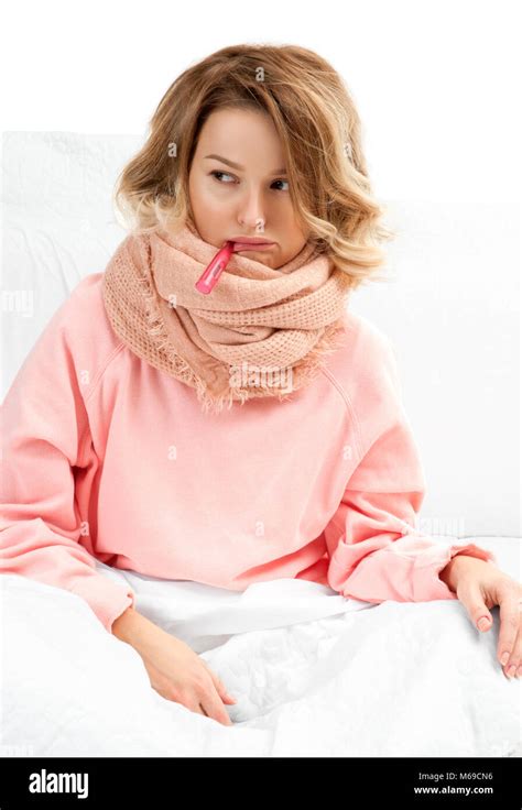 Woman Having A Cold Flu Sore Throat Coughing And Fever Stock Photo