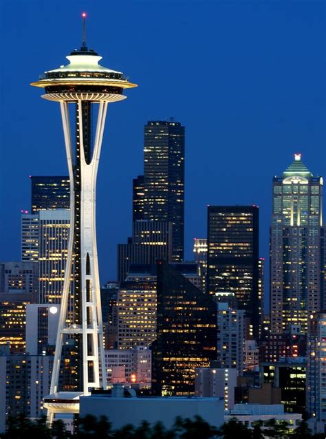 The space needle has a 200 seat revolving restaurant, an observation deck and a gift shop at the base. Space Needle In Seattle Photograph by Jetson Nguyen