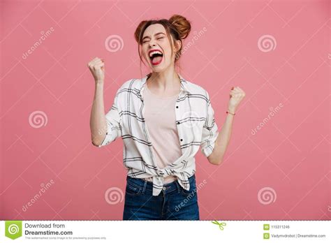 Portrait Of An Excited Young Girl Celebrating Success Stock Photo