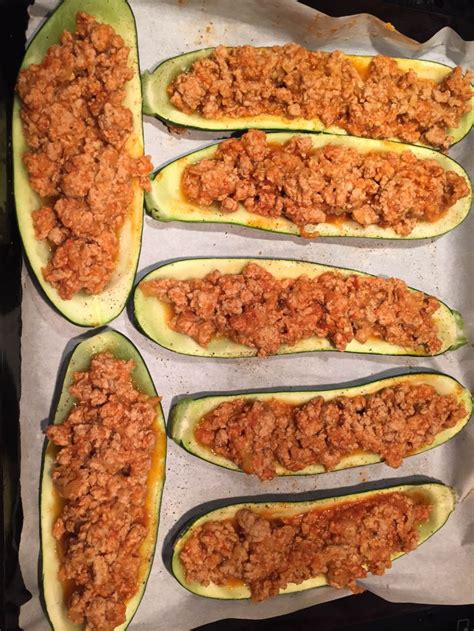 Hollowed out zucchini squash is stuffed with cooked ground chicken mixed with buffalo wing sauce. Stuffed Baked Zucchini Boats With Ground Meat And Cheese ...
