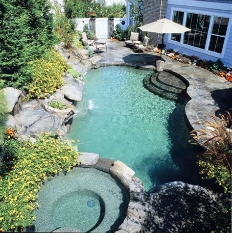 Grottos And Waterfalls Tropical Swimming Pool And Hot Tub Orange