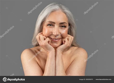 Beautiful Mature Woman With Nude Body Looking At Camera And Smiling
