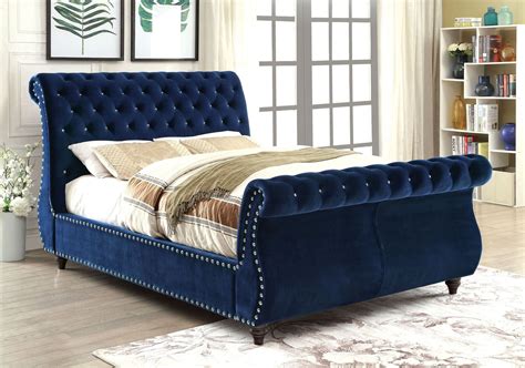 Spiraling vine, leaf and swag, acanthus leaf, and shell. Noella Navy Queen Upholstered Sleigh Bed from Furniture of America | Coleman Furniture