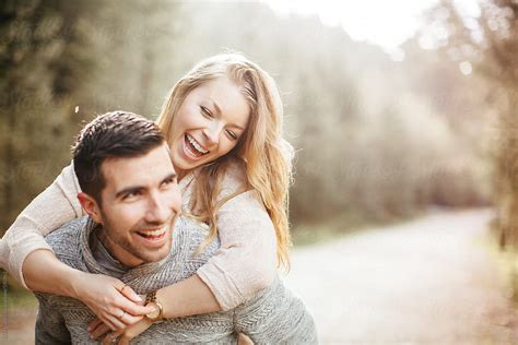 Young Good Looking Couple Laughing Together By Luke Liable