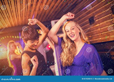 Composite Image Of Two Beautiful Women Dancing On Dance Floor Stock