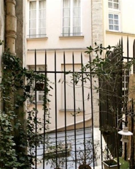 Two Windows Overlook The Courtyard Beyond St Germain Des Pres Awaits