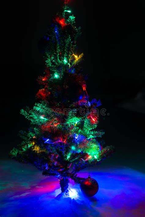 Shining Lights Of A Natural Christmas Tree Covered Snow Macro Stock