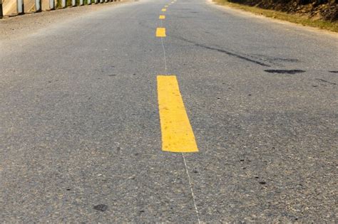 Premium Photo Yellow Broken Line On Asphalt Road Road Marking