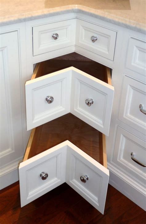 The lazy susan features a central access which the shelves spin from. 5 Lazy Susan Alternatives | Corner kitchen cabinet, Corner drawers, Kitchen remodel design