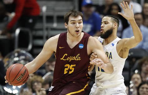 The ramblers play all home games at the joseph j. Loyola-Chicago center Cameron Krutwig (25) works against ...