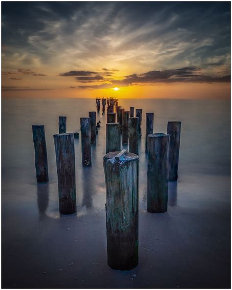 Old Pilings Of Naples A Dramatic Sky And A Long Exposure Makes For A