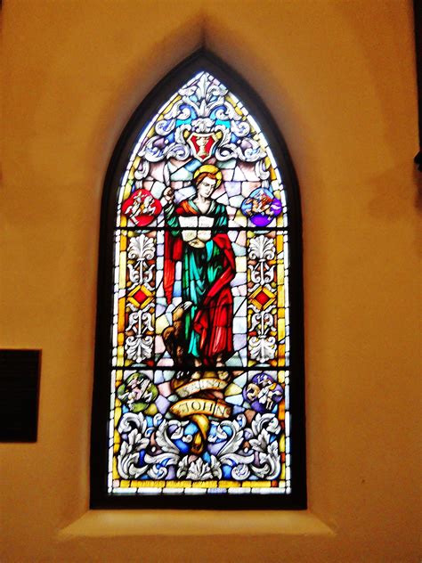 The Stained Glass Window Of Saint John Along The Nave At St John S With Images Gothic