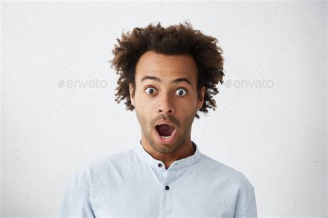 Body Language Headshot Of Attractive And Surprised African American