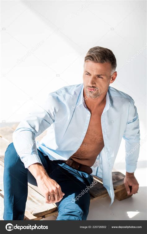 Attractive Adult Man Unbuttoned Shirt Sitting Wooden Pallet White