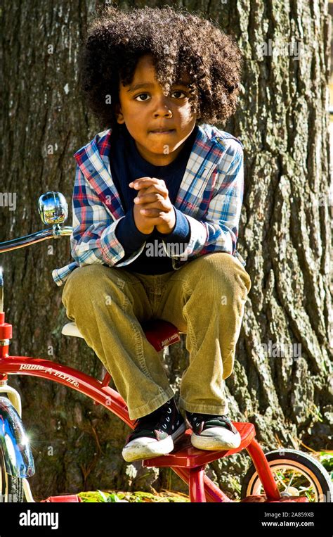 Little Boy On Tricycle Stock Photo Alamy