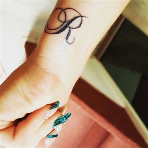 Initial tattoos can express strong emotions and deep love and … Initial letter R tattoo - love | Tatuaje de r, Tatuaje ...