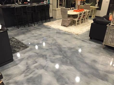 We use only the best garage if you want something with more personality, we can incorporate multiple colors and patterns, even sports logos. Metallic grey epoxy floor installed by The Garage Floor Co ...