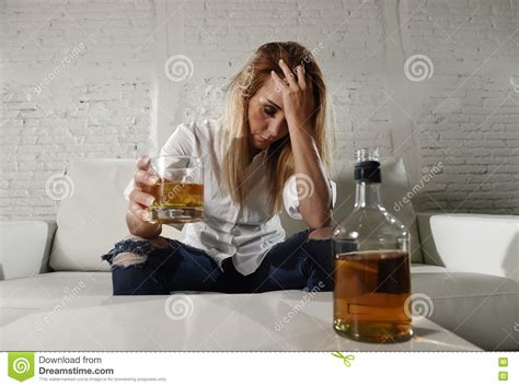 Sad Depressed Alcoholic Drunk Woman Drinking At Home In Housewife