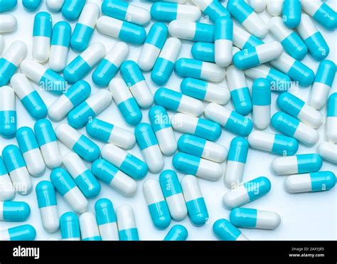 Blue White Capsule Pills On White Table Full Frame Of Capsule Drug