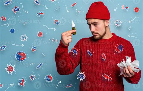 Boy Caught A Cold And Uses Spray To Heal Studio On Cyan Background