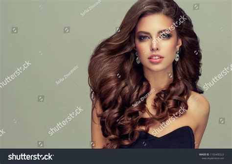 Brunette Woman With Long Healthy And Shiny Curly Hair Beautiful