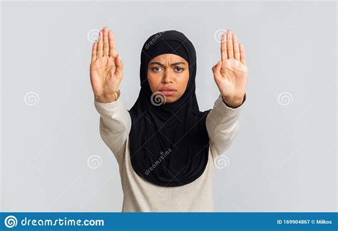Serious Black Muslim Woman Showing Stop Gesture With Two Open Palms Stock Image Image Of Face