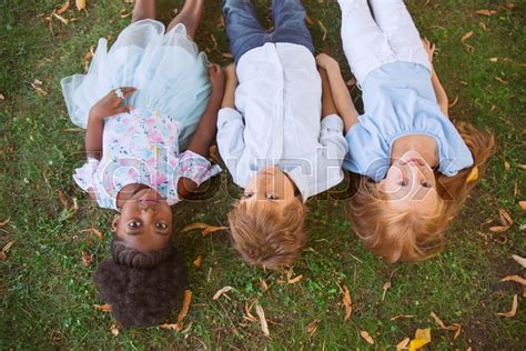 Lying Down Interracial Group Of Kids Stock Image Colourbox
